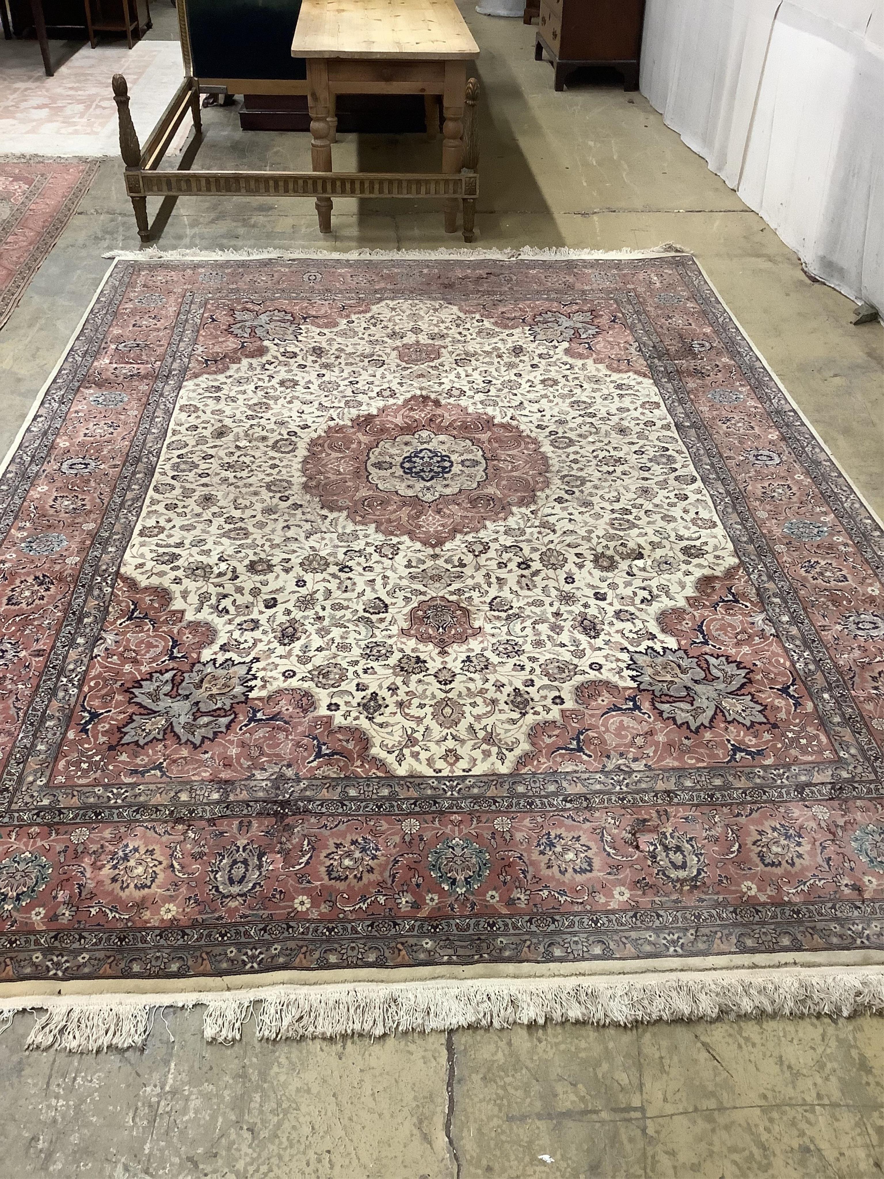 An Isfahan design ivory ground rug, approximately 340 x 246cm. Condition - good